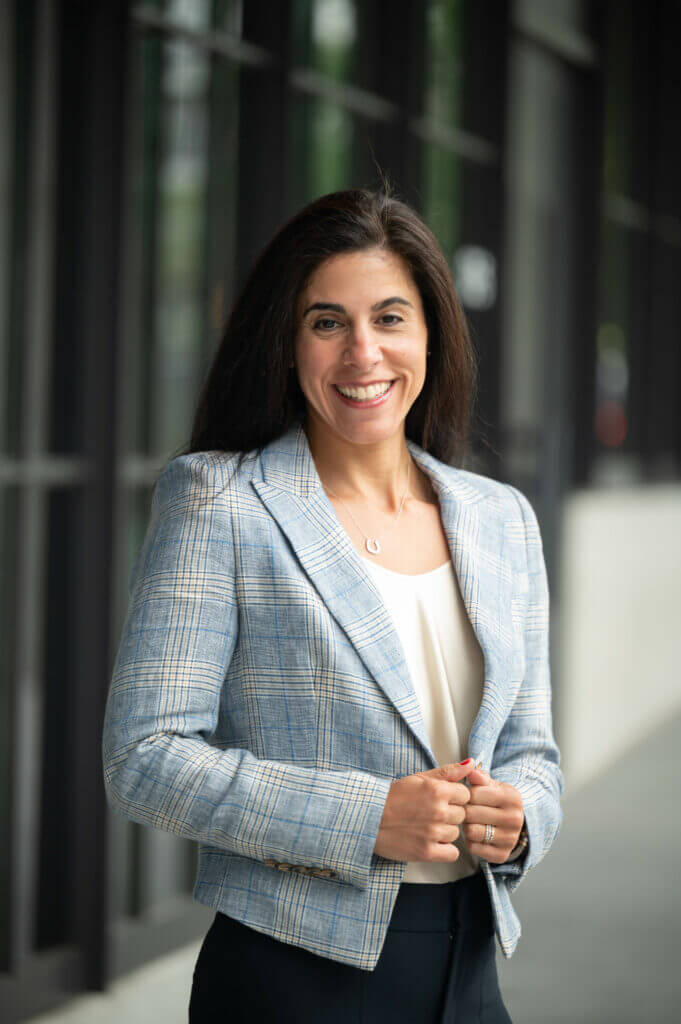 A woman smiling at the camera